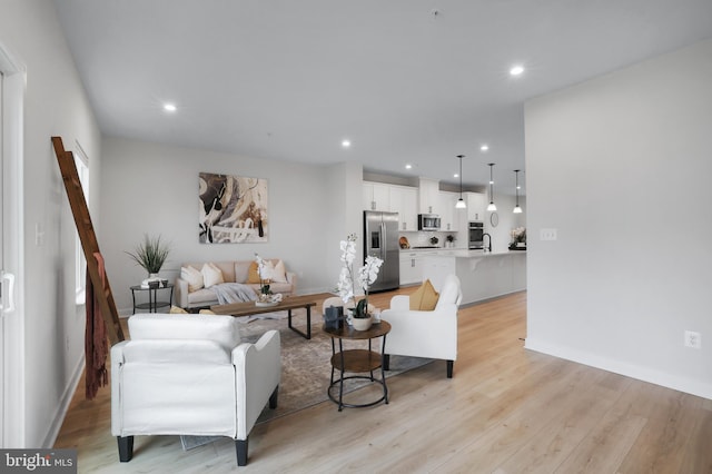 8109 Primrose Ln, Laurel, MD 20723 - living area featuring light wood-style flooring and recessed lighting