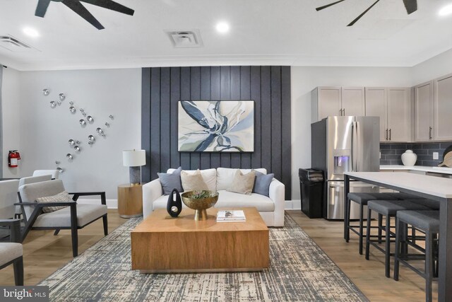 8109 Primrose Ln, Laurel, MD 20723 - living room featuring a ceiling fan, recessed lighting, and light wood-type flooring