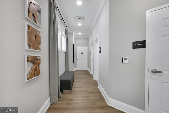 8109 Primrose Ln, Laurel, MD 20723 - hallway with light wood-style flooring, ornamental molding, and recessed lighting