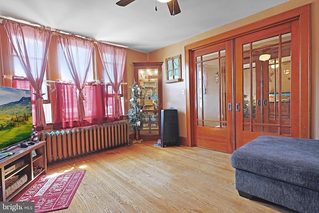 439 Columbia St, Cumberland, MD 21502 - bedroom featuring radiator, french doors, and wood finished floors