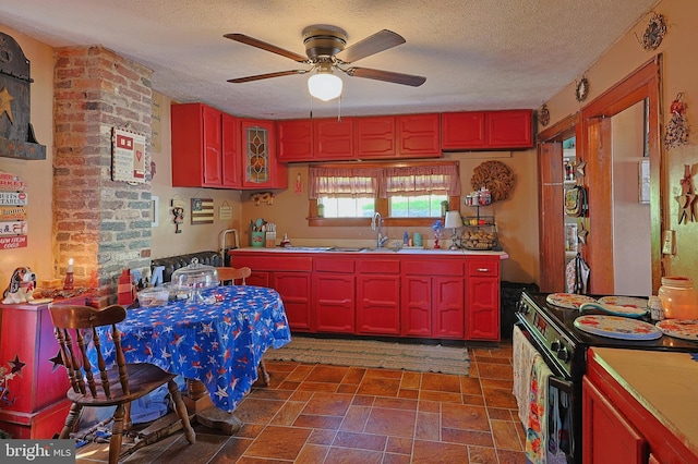 439 Columbia St, Cumberland, MD 21502 - kitchen with black range with electric stovetop, a textured ceiling, ceiling fan, stone finish floors, and light countertops