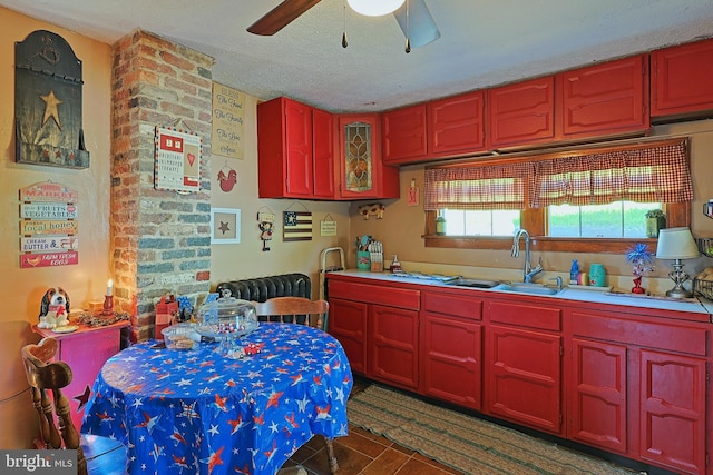 439 Columbia St, Cumberland, MD 21502 - kitchen featuring a ceiling fan, a textured ceiling, light countertops, and reddish brown cabinets