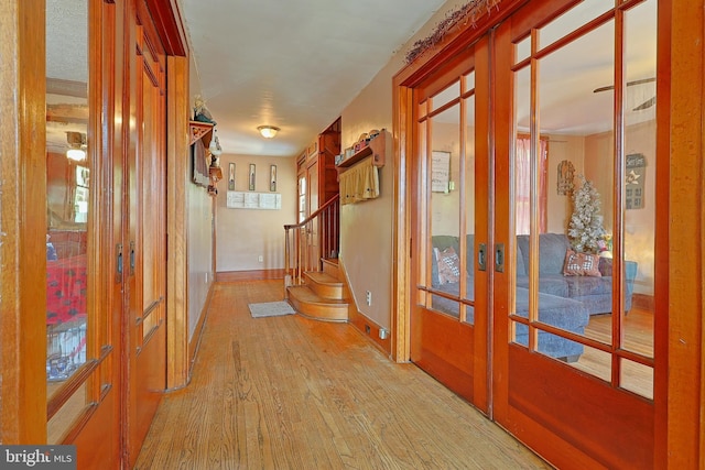 439 Columbia St, Cumberland, MD 21502 - hallway featuring hardwood / wood-style floors, french doors, and stairway