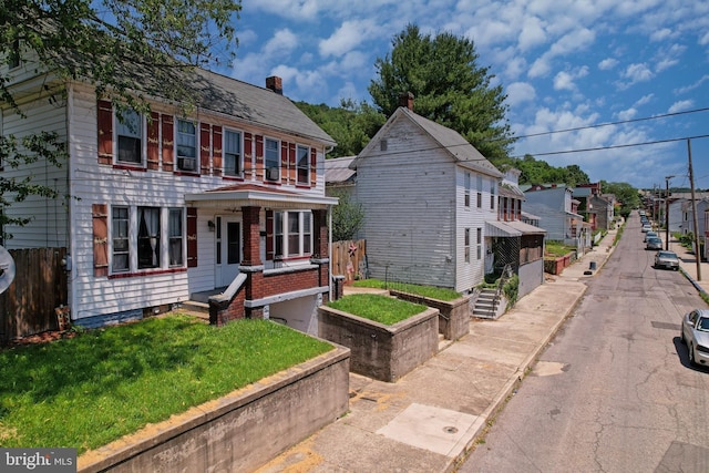 439 Columbia St, Cumberland, MD 21502 - view of front of house with a residential view and a chimney