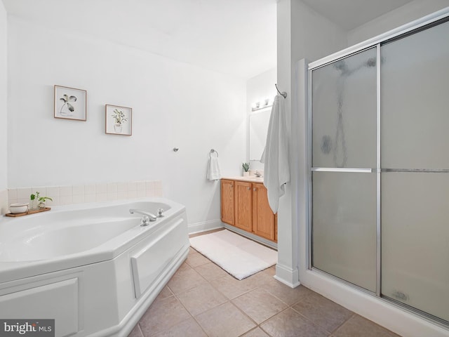 207 Drawyers Dr, Middletown, DE 19709 - bathroom with vanity, a stall shower, a garden tub, and tile patterned floors