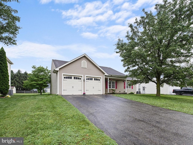 207 Drawyers Dr, Middletown, DE 19709 - single story home featuring an attached garage, asphalt driveway, and a front lawn