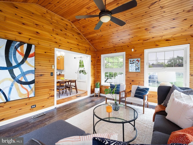 207 Drawyers Dr, Middletown, DE 19709 - living room featuring vaulted ceiling, wood walls, wood finished floors, ceiling fan, and wood ceiling