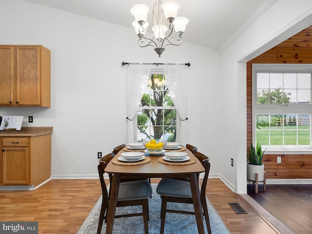 207 Drawyers Dr, Middletown, DE 19709 - dining space featuring light wood finished floors, a chandelier, healthy amount of natural light, and lofted ceiling