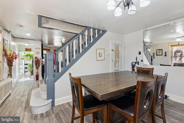 5509 Chew Ave, Philadelphia, PA 19138 - dining space with stairway, wood finished floors, and a chandelier