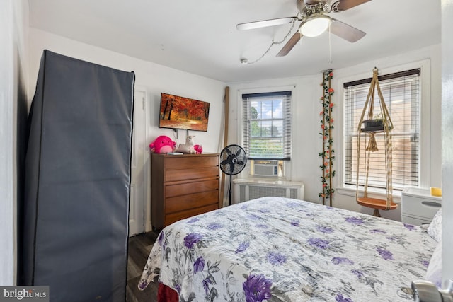 5509 Chew Ave, Philadelphia, PA 19138 - bedroom with wood finished floors, cooling unit, radiator, and a ceiling fan