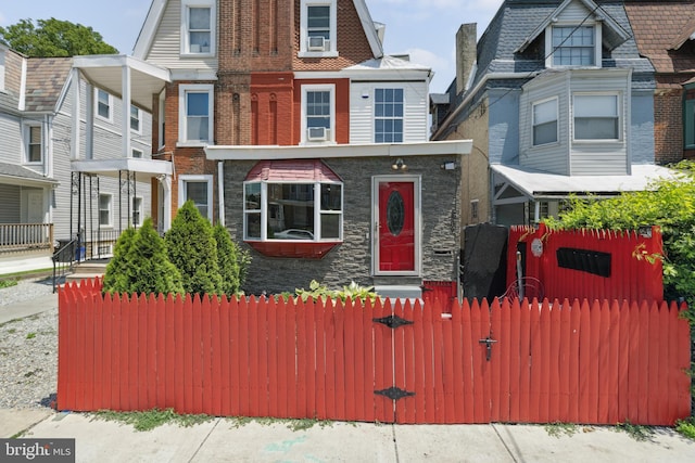 5509 Chew Ave, Philadelphia, PA 19138 - view of front of property featuring a fenced front yard, cooling unit, and brick siding