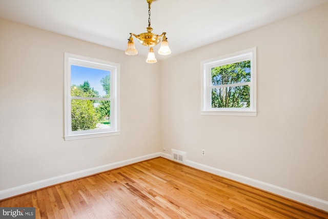 5909 Frederick St, Springfield, VA 22150 - unfurnished room with a chandelier and light wood-style flooring