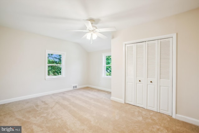 5909 Frederick St, Springfield, VA 22150 - unfurnished bedroom featuring multiple windows, carpet flooring, a closet, vaulted ceiling, and ceiling fan