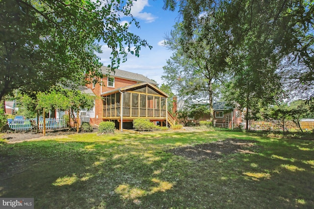 5909 Frederick St, Springfield, VA 22150 - rear view of house with a sunroom and an outdoor structure