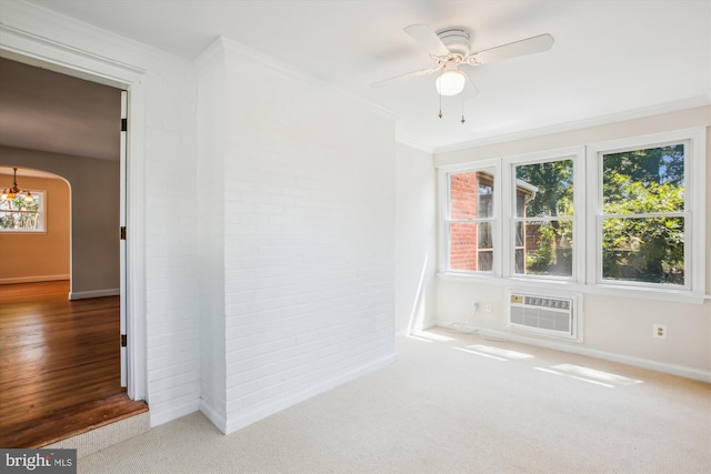 5909 Frederick St, Springfield, VA 22150 - empty room with a wall mounted AC, carpet, brick wall, ornamental molding, and arched walkways