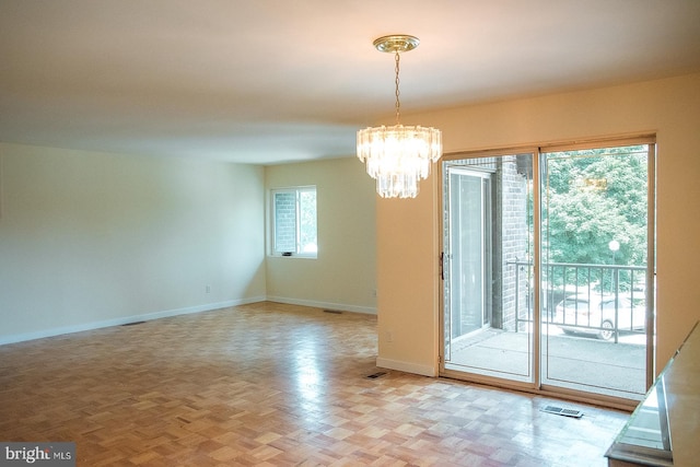 16 Stonehenge Cir Unit 16-5, Baltimore, MD 21208 - unfurnished room featuring a chandelier and baseboards