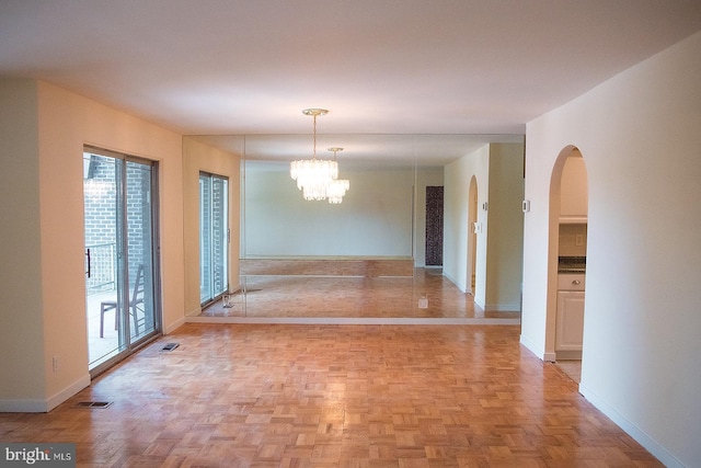 16 Stonehenge Cir Unit 16-5, Baltimore, MD 21208 - unfurnished dining area featuring a chandelier and arched walkways