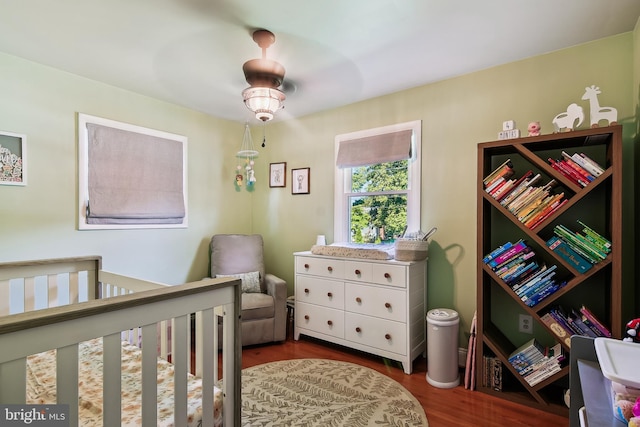 14 Nicholson Dr, Pasadena, MD 21122 - bedroom with wood finished floors and a crib