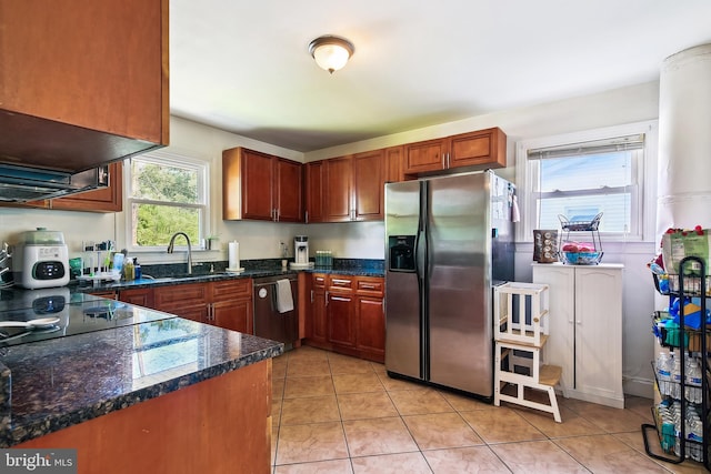 14 Nicholson Dr, Pasadena, MD 21122 - kitchen with stainless steel fridge, dishwashing machine, light tile patterned flooring, and dark stone countertops