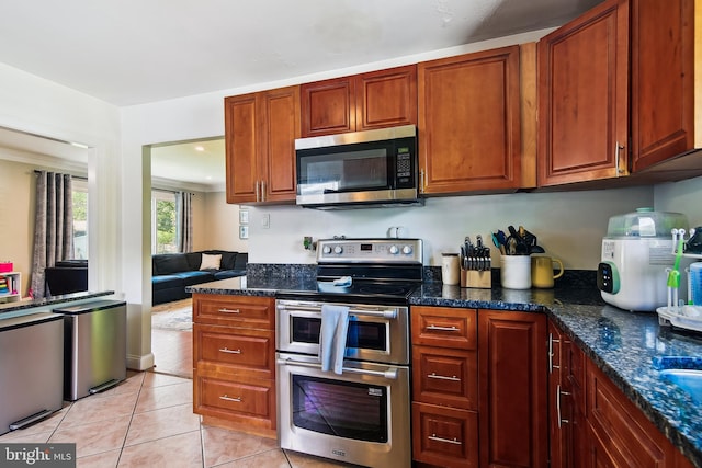 14 Nicholson Dr, Pasadena, MD 21122 - kitchen featuring appliances with stainless steel finishes, light tile patterned flooring, and dark stone countertops