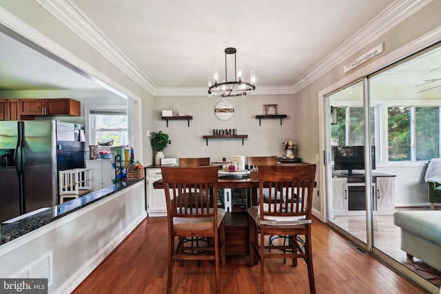 14 Nicholson Dr, Pasadena, MD 21122 - dining room featuring a chandelier, dark wood-style flooring, and ornamental molding