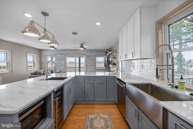 1 Risner Ave, Penns Grove, NJ 08069 - kitchen featuring gray cabinetry, stainless steel appliances, wine cooler, light stone countertops, and white cabinets