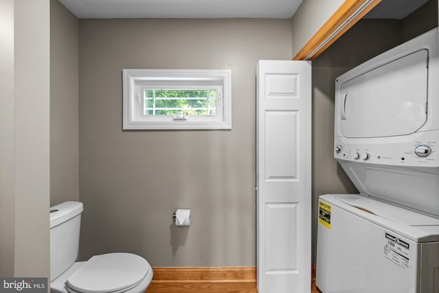 1 Risner Ave, Penns Grove, NJ 08069 - laundry area featuring stacked washer and clothes dryer and baseboards