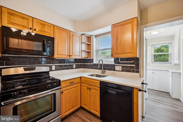 2013 Dayton St, Silver Spring, MD 20902 - kitchen featuring black appliances, wood finished floors, backsplash, and open shelves
