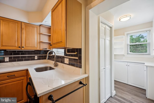 2013 Dayton St, Silver Spring, MD 20902 - kitchen featuring open shelves, backsplash, light stone countertops, and light wood-type flooring