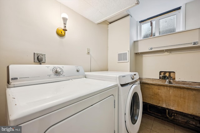 2013 Dayton St, Silver Spring, MD 20902 - laundry area with independent washer and dryer and tile patterned flooring