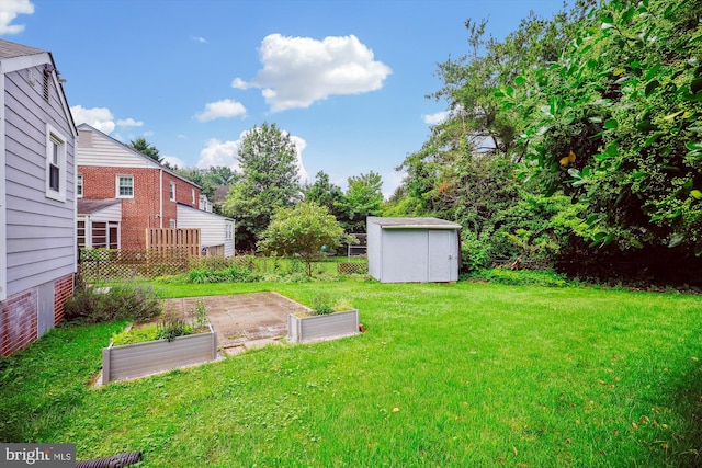 2013 Dayton St, Silver Spring, MD 20902 - view of green lawn featuring a garden and a storage shed