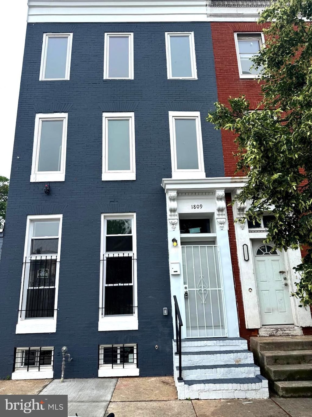 1809 W Lombard St, Baltimore, MD 21223 - view of property with entry steps and brick siding