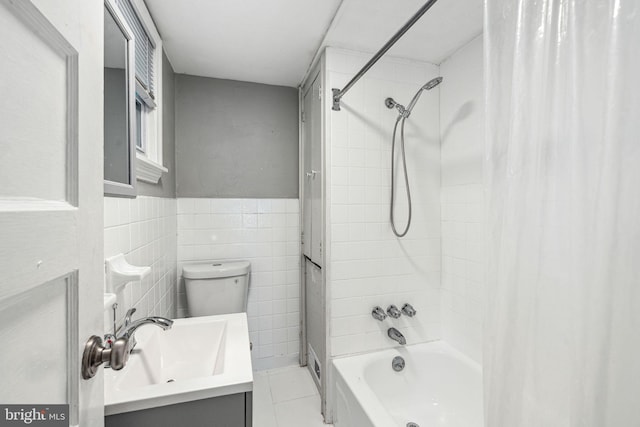 2006 N Mascher St, Philadelphia, PA 19122 - bathroom featuring shower / bath combo with shower curtain, vanity, tile patterned flooring, a wainscoted wall, and tile walls