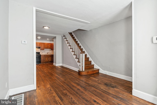 2006 N Mascher St, Philadelphia, PA 19122 - stairway with baseboards and wood finished floors