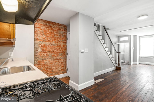 2006 N Mascher St, Philadelphia, PA 19122 - kitchen featuring brick wall and hardwood / wood-style floors