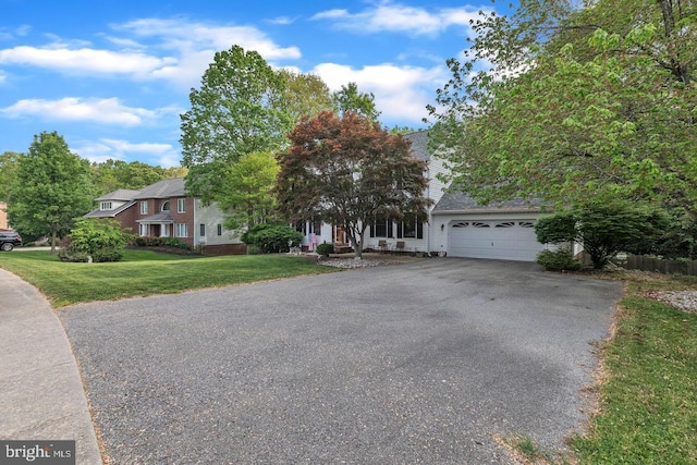 1016 Wiltshire Dr, La Plata, MD 20646 - view of front of home featuring asphalt driveway, a front yard, and an attached garage