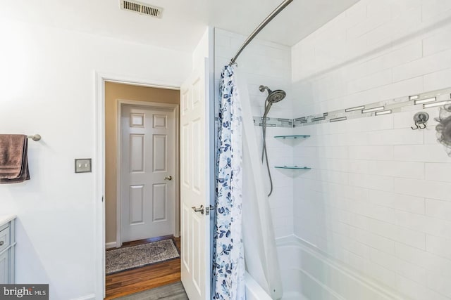 1016 Wiltshire Dr, La Plata, MD 20646 - full bath featuring shower / tub combo, vanity, and wood finished floors