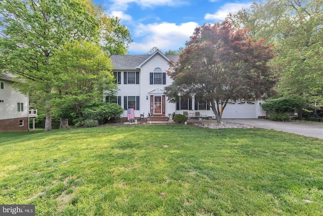 1016 Wiltshire Dr, La Plata, MD 20646 - colonial inspired home with asphalt driveway and a front lawn