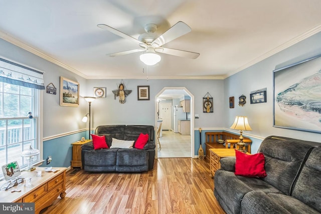 1016 Wiltshire Dr, La Plata, MD 20646 - living area featuring arched walkways, ceiling fan, ornamental molding, and light wood-type flooring