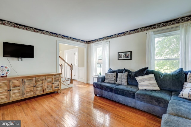 2912 Weaver Rd, Lancaster, PA 17601 - living room featuring plenty of natural light, light wood-style floors, stairs, and a wainscoted wall