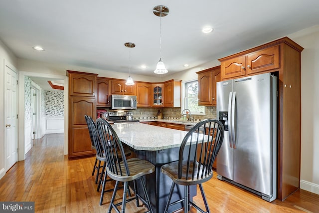 2912 Weaver Rd, Lancaster, PA 17601 - kitchen featuring stainless steel appliances, light wood-style floors, tasteful backsplash, and recessed lighting