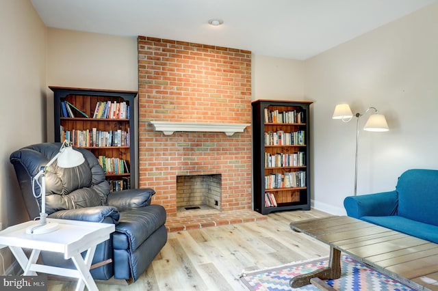 2912 Weaver Rd, Lancaster, PA 17601 - living area featuring wood finished floors and a brick fireplace