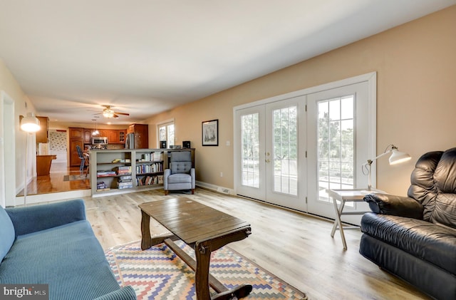 2912 Weaver Rd, Lancaster, PA 17601 - living room featuring light wood-style flooring, ceiling fan, and french doors