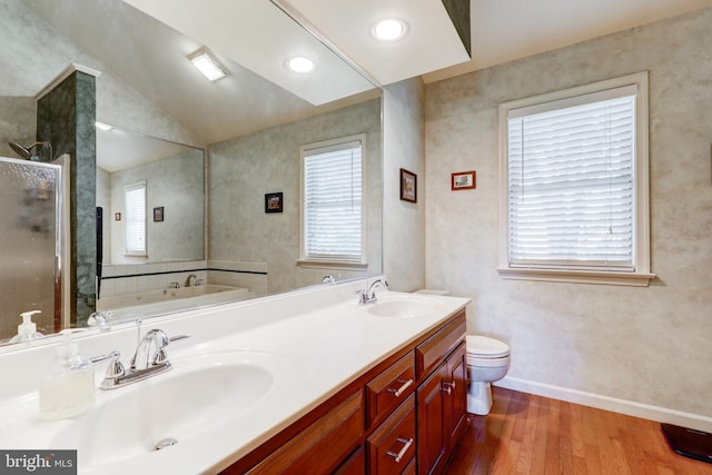2912 Weaver Rd, Lancaster, PA 17601 - bathroom with wood finished floors, a stall shower, double vanity, a garden tub, and vaulted ceiling