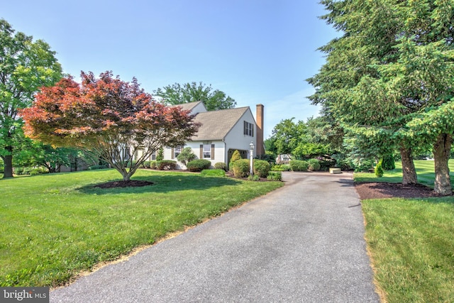 2912 Weaver Rd, Lancaster, PA 17601 - view of property hidden behind natural elements with a chimney and a front yard