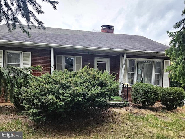 2304 Front Royal Pike, Winchester, VA 22602 - view of front of property featuring a chimney, brick siding, and roof with shingles