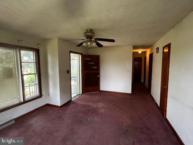 2304 Front Royal Pike, Winchester, VA 22602 - carpeted foyer featuring ceiling fan and a baseboard heating unit