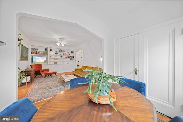 2737 Devonshire Pl NW Unit 321, Washington, DC 20008 - dining space with built in shelves, ceiling fan, and wood finished floors