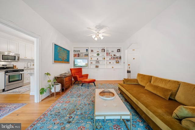 2737 Devonshire Pl NW Unit 321, Washington, DC 20008 - living area with light wood-style floors, a ceiling fan, and built in features