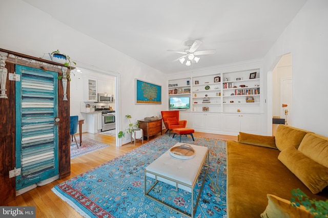 2737 Devonshire Pl NW Unit 321, Washington, DC 20008 - living area with ceiling fan, light wood finished floors, and built in shelves